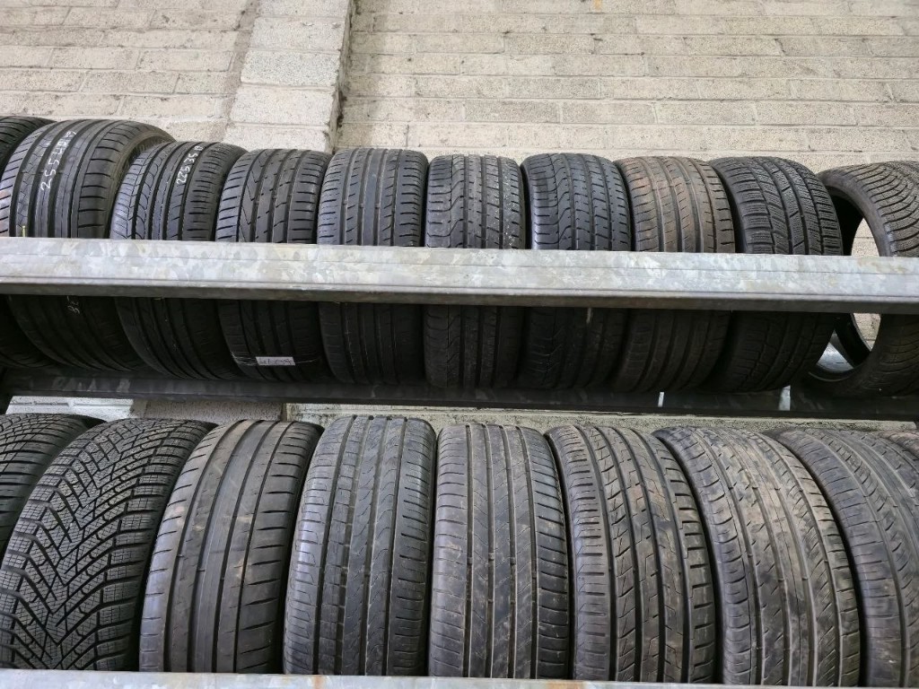 Part-worn tyres on metal racking